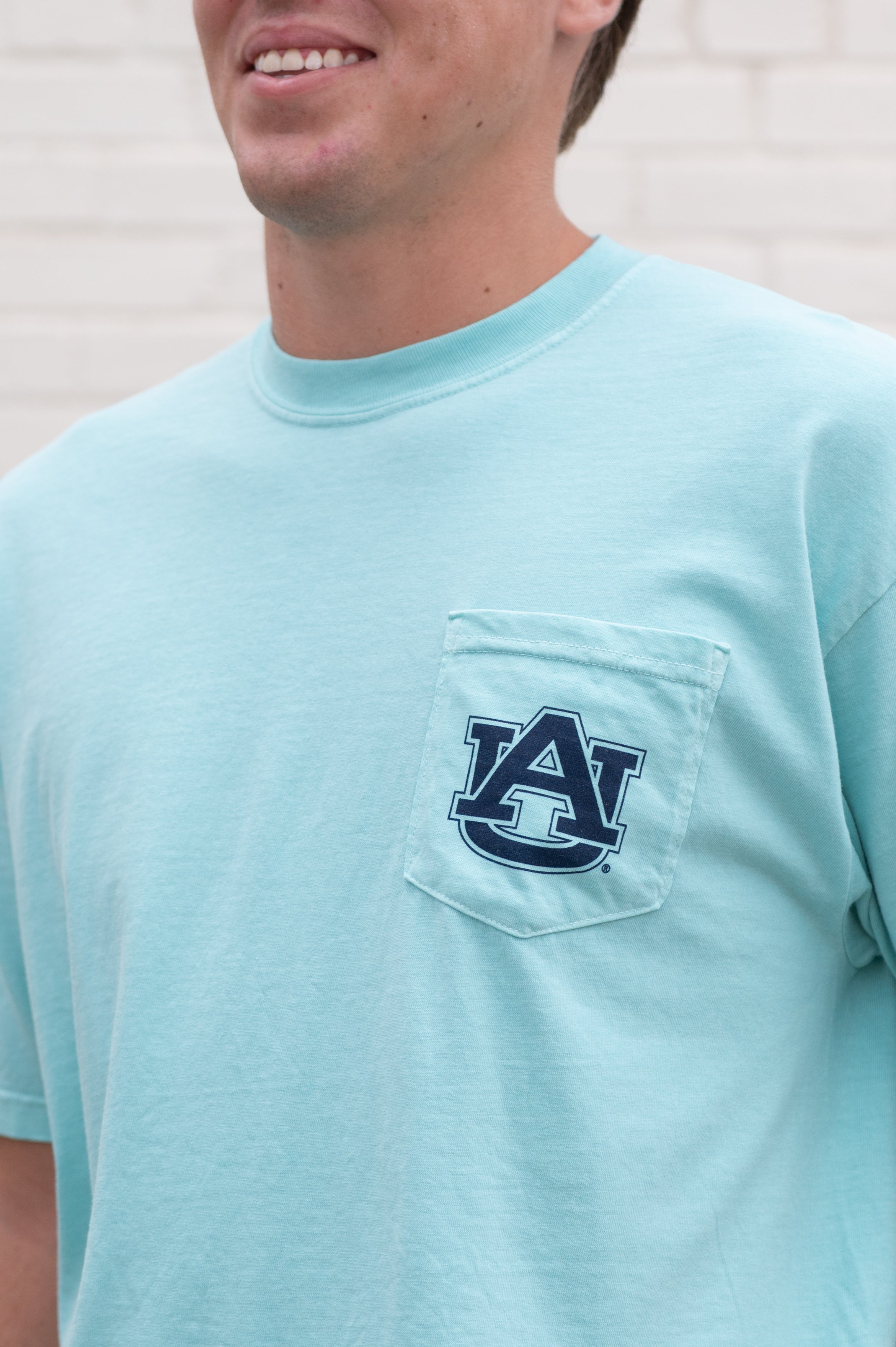 Auburn University Light Blue T-Shirt with an image of Aubie wakeboarding in between text “Summertime Blues”