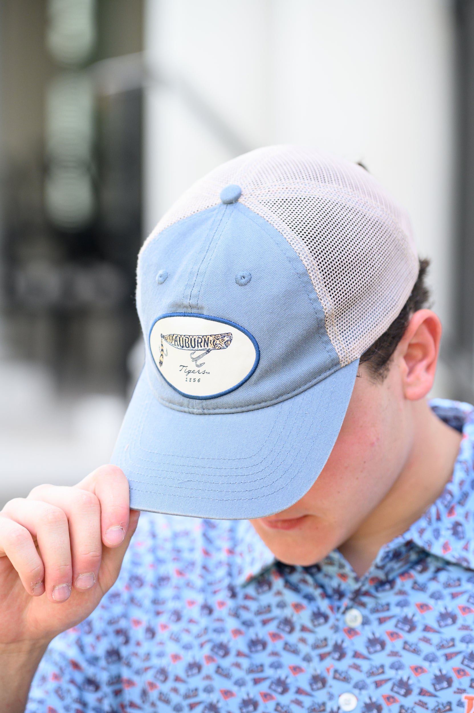 Auburn University Dusty Navy Hat featuring a patch with a tiger fishing lure with the Blue text “Auburn”