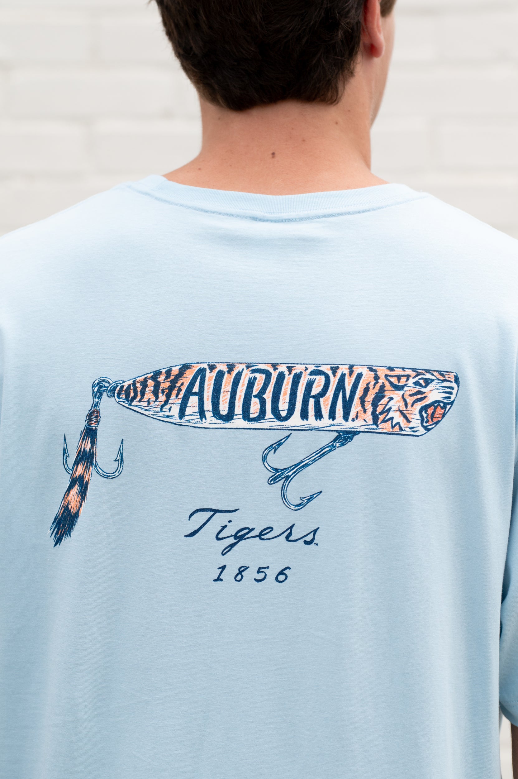 Auburn University Light Blue T-Shirt with a tiger fishing lure with the Blue text “Auburn”