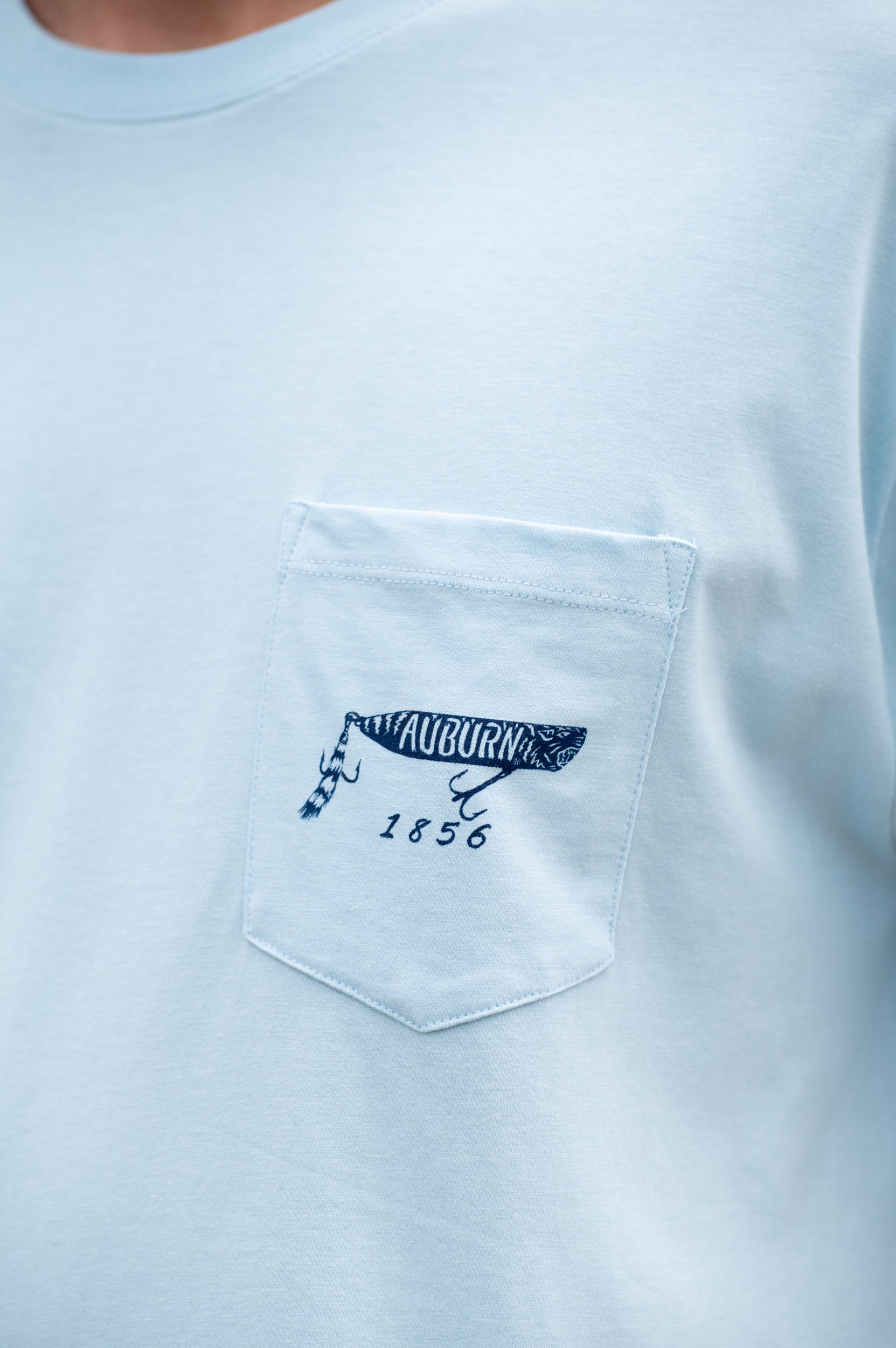 Auburn University Light Blue T-Shirt with a tiger fishing lure with the Blue text “Auburn”