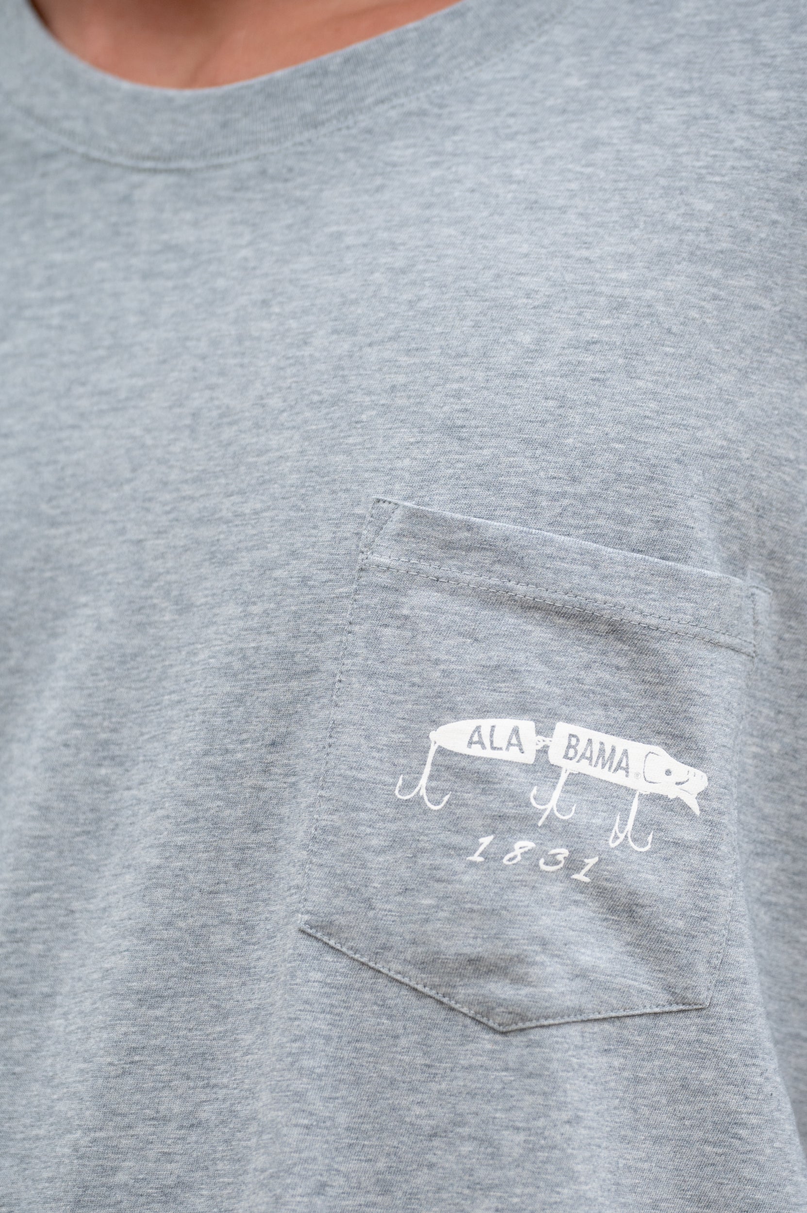 University of Alabama Gray T-Shirt with an image of a fishing lure with Red text "Alabama" above White text “The Tide 1831”