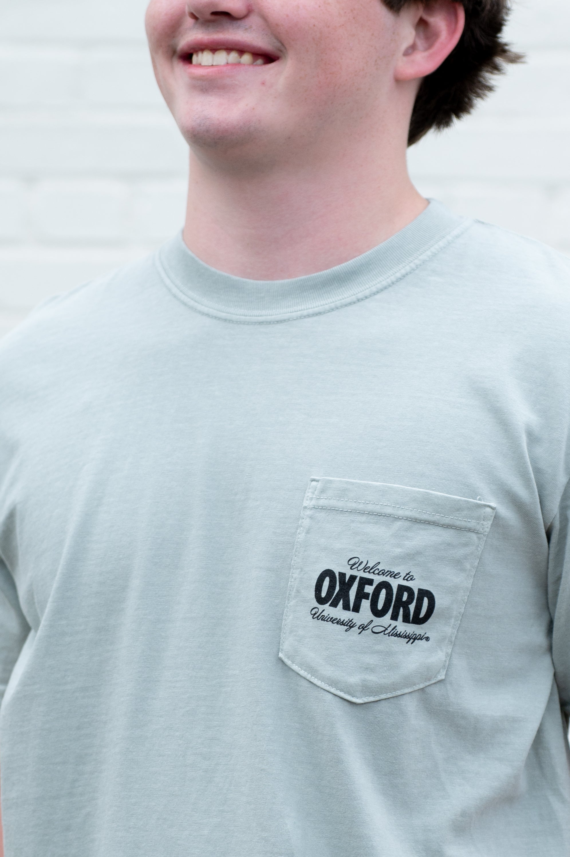 Ole Miss Green T-Shirt with postcard style text "Greetings From OXFORD" with "Oxford" filled with images of iconic buildings in that location