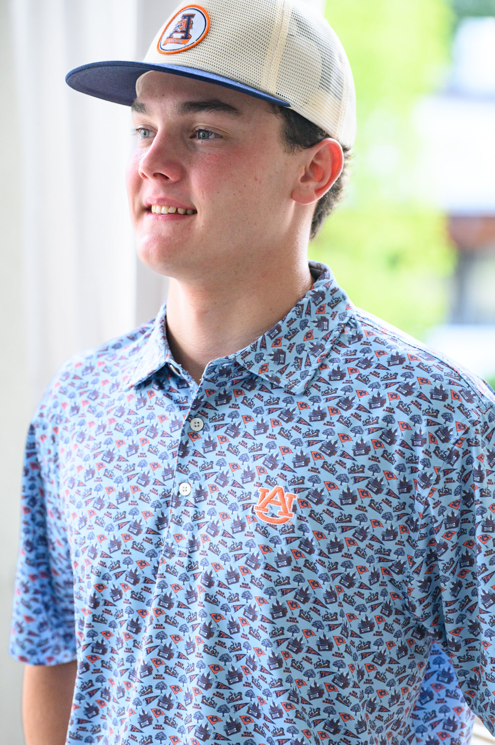Auburn University White and Navy Hat with embroidery of Aubie leaping through an "A"