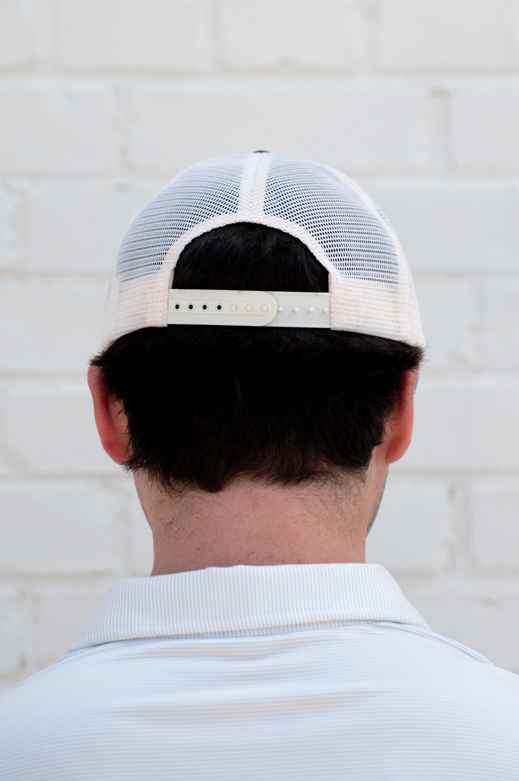 Auburn University White and Navy Hat with embroidery of Aubie leaping through an "A"