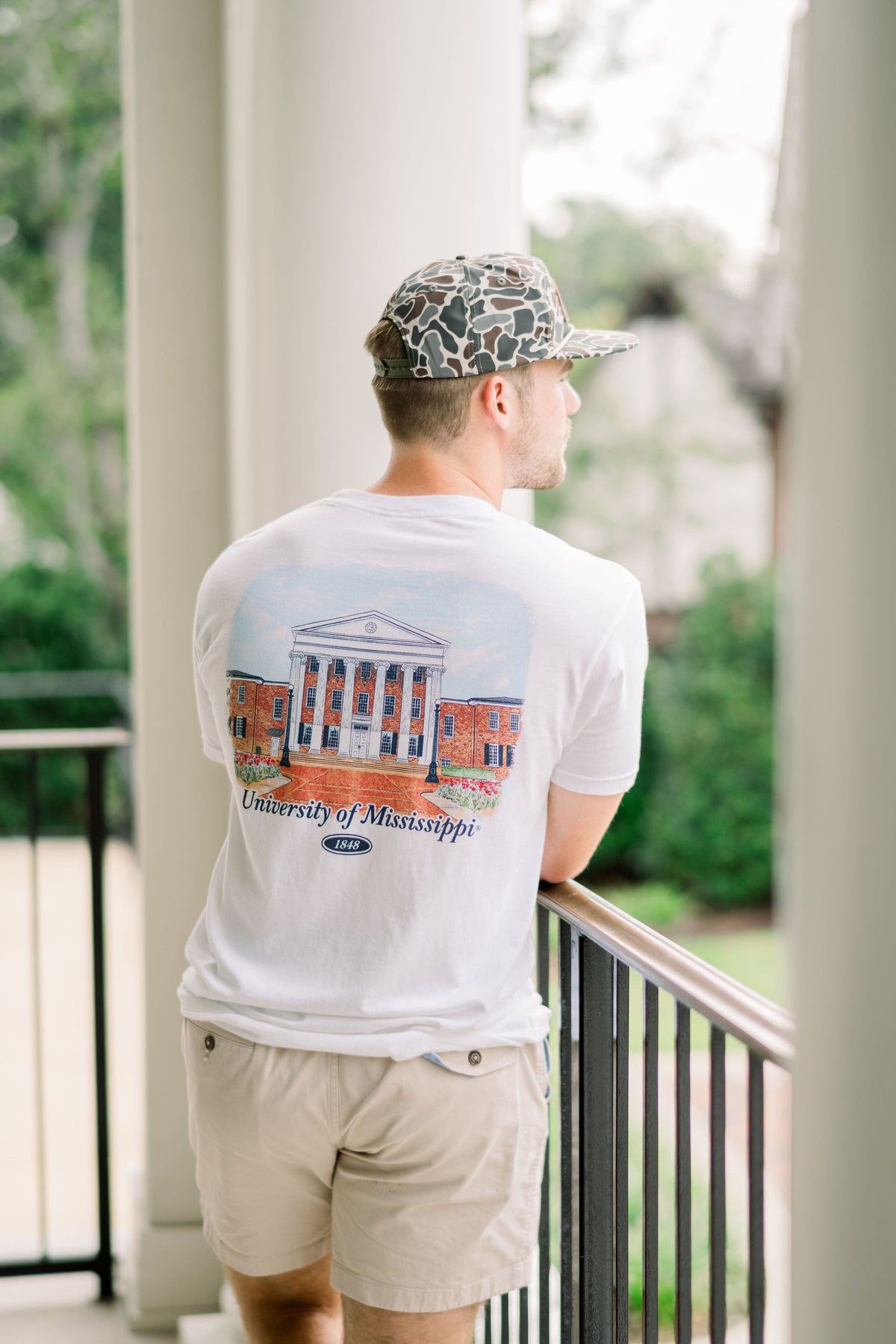 Ole Miss White T-Shirt with an illustration of the Lyceum building over Navy text “University of Mississippi”