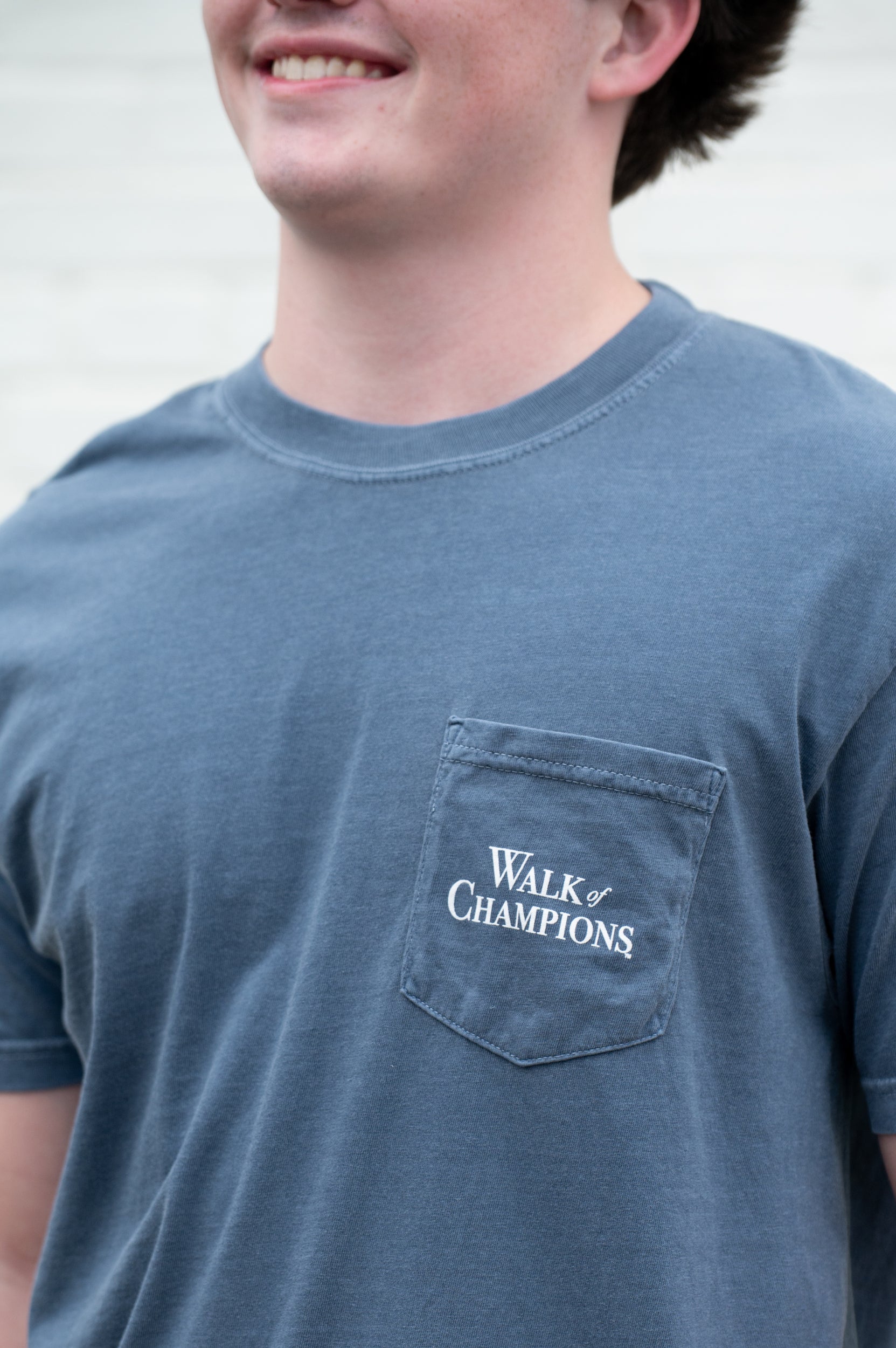 Ole Miss Dusty Navy T-Shirt with an illustration of the Mississippi University Walk of Champions