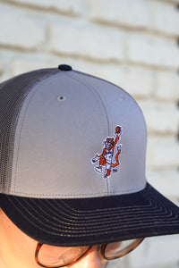 Auburn University Grey and Navy Trucker Hat with the Original Aubie basketball logo on the front, featuring a gray crown and black visor.