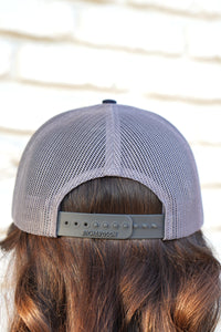 Auburn University Grey and Navy Trucker Hat with the Original Aubie basketball logo on the front, featuring a gray crown and black visor.