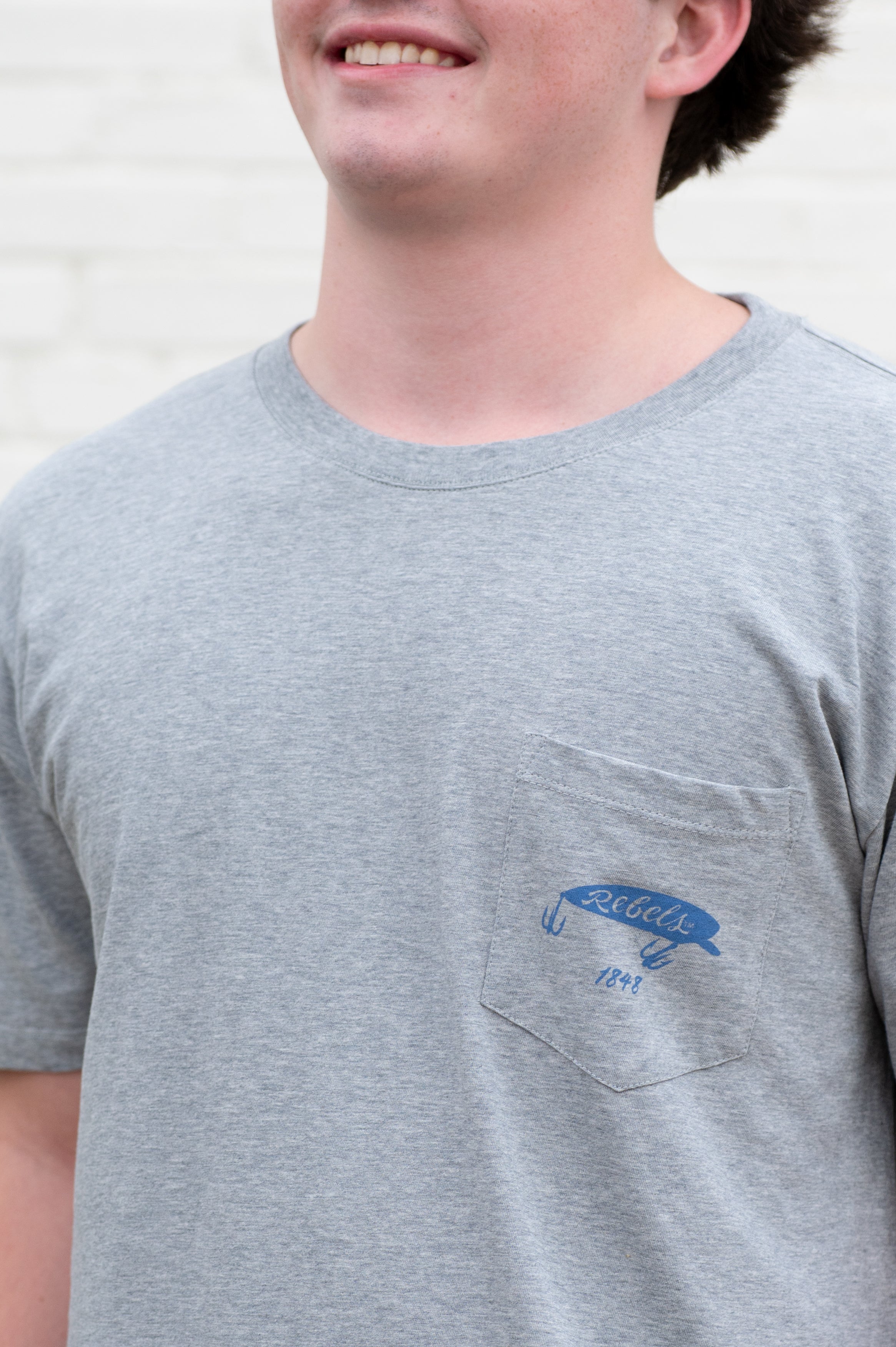 Ole Miss Grey T-Shirt with a fishing lure with Red script “Rebels”