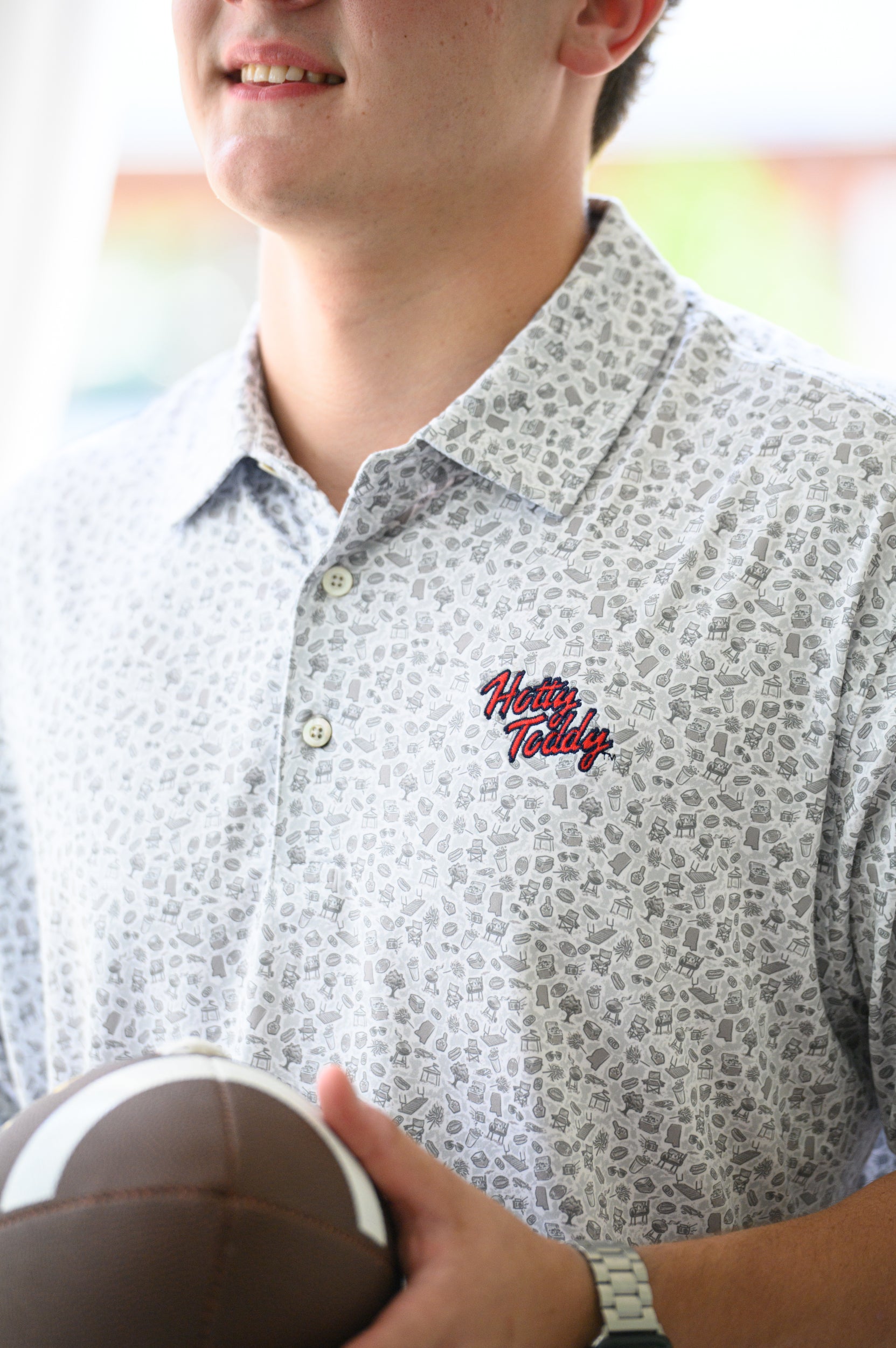 Mississippi State Grey Men’s Patterned Polo with a tailgate themed pattern and the Script State Logo embroidery