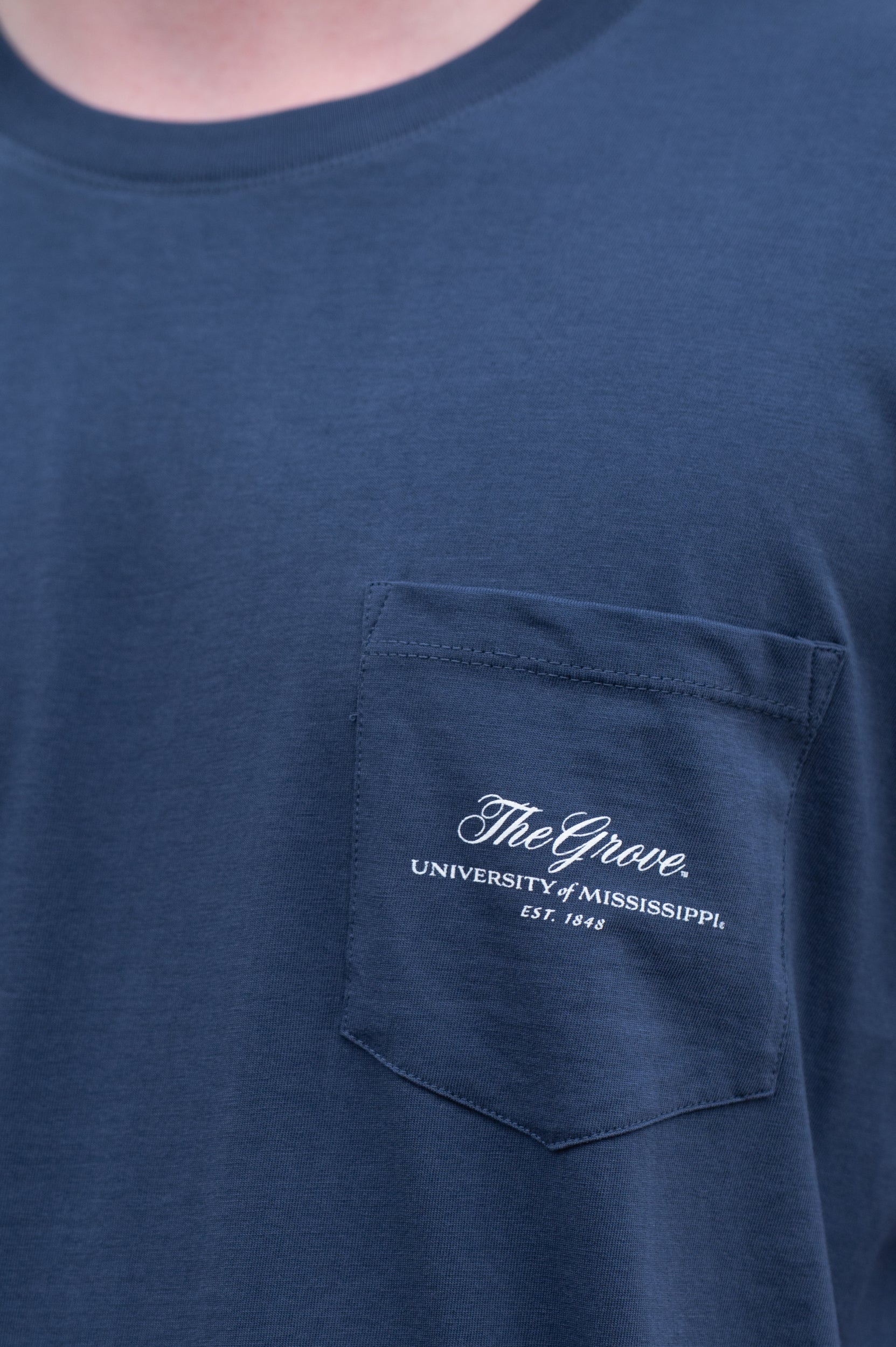 Ole Miss Navy T-Shirt with an outline of Mississippi and an image of The Grove during tailgating inside