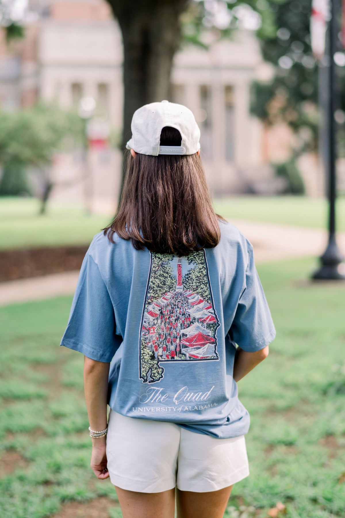 University of Alabama Blue-Grey Shirt with an illustration of a crowd on the Quad inside the Alabama state outline